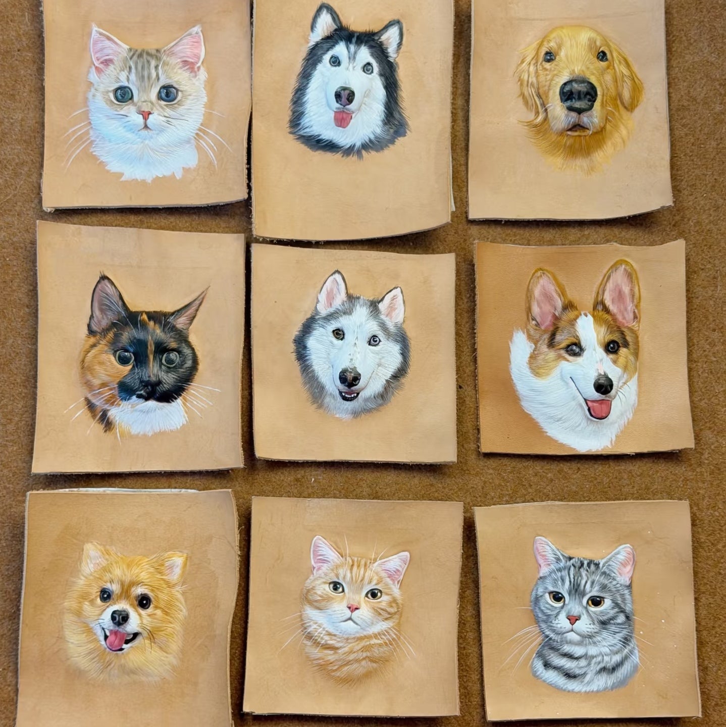 Nine brown leather with painted portraits of cats and dogs on a brown background