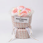 Bouquet of pink flowers in a decorative container with 'ROSE MEANS LOVE' text on a white background
