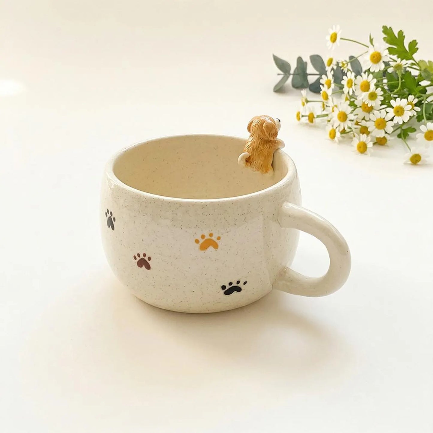 Custom pet ceramic mug with 'Charlie' and paw prints, featuring a small dog figurine on a light background.